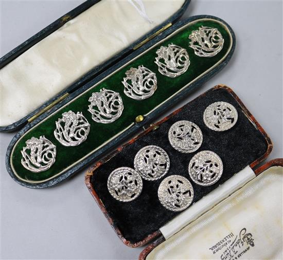 Two sets of six Edwardian silver buttons.